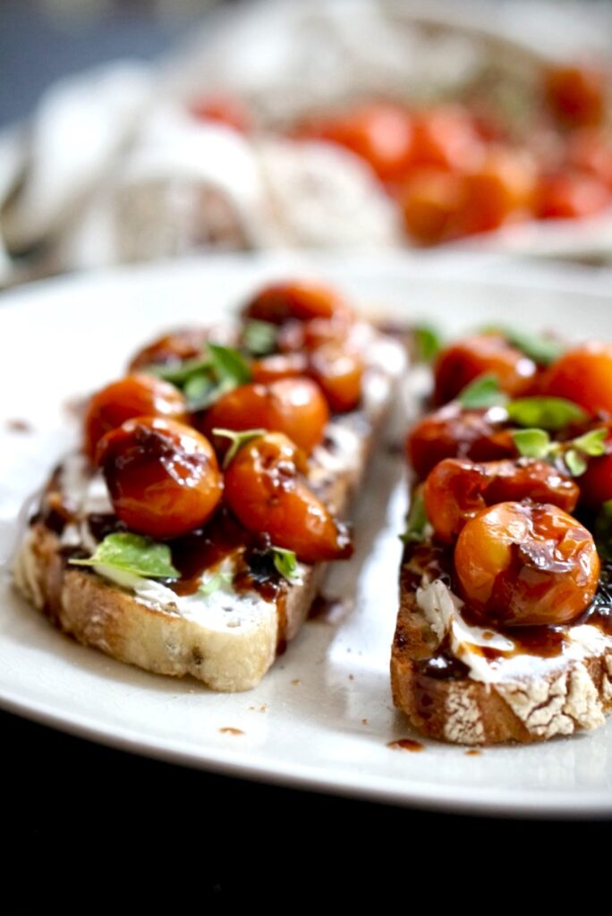 close up bruschetta with caramelized cherry tomatoes balsamic glaze